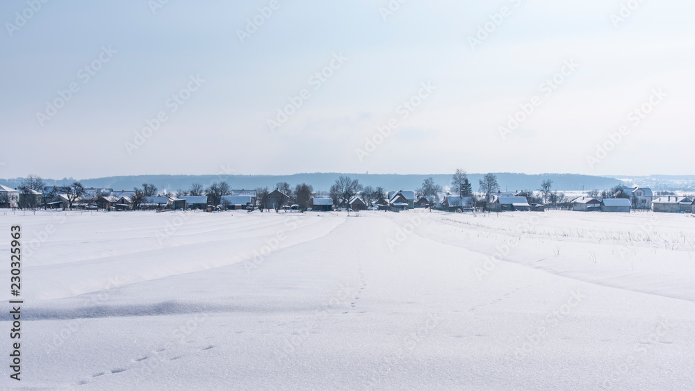 Winter landscape, view of village from afar. Western Ukraine