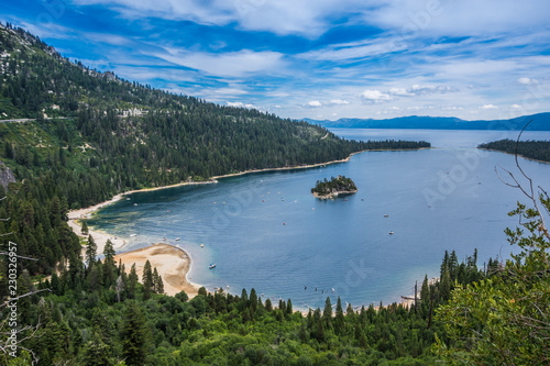 Emerald Bay view with Fannette Island in South Lake Tahoe California in the Sierra Nevada mountains. Sunshine in the summer, boats on the water