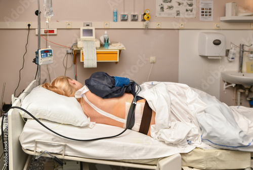 The women lies in the birthplace with contractions and epidural anesthesia photo