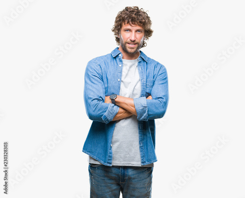 Handsome hispanic model man over isolated background happy face smiling with crossed arms looking at the camera. Positive person.