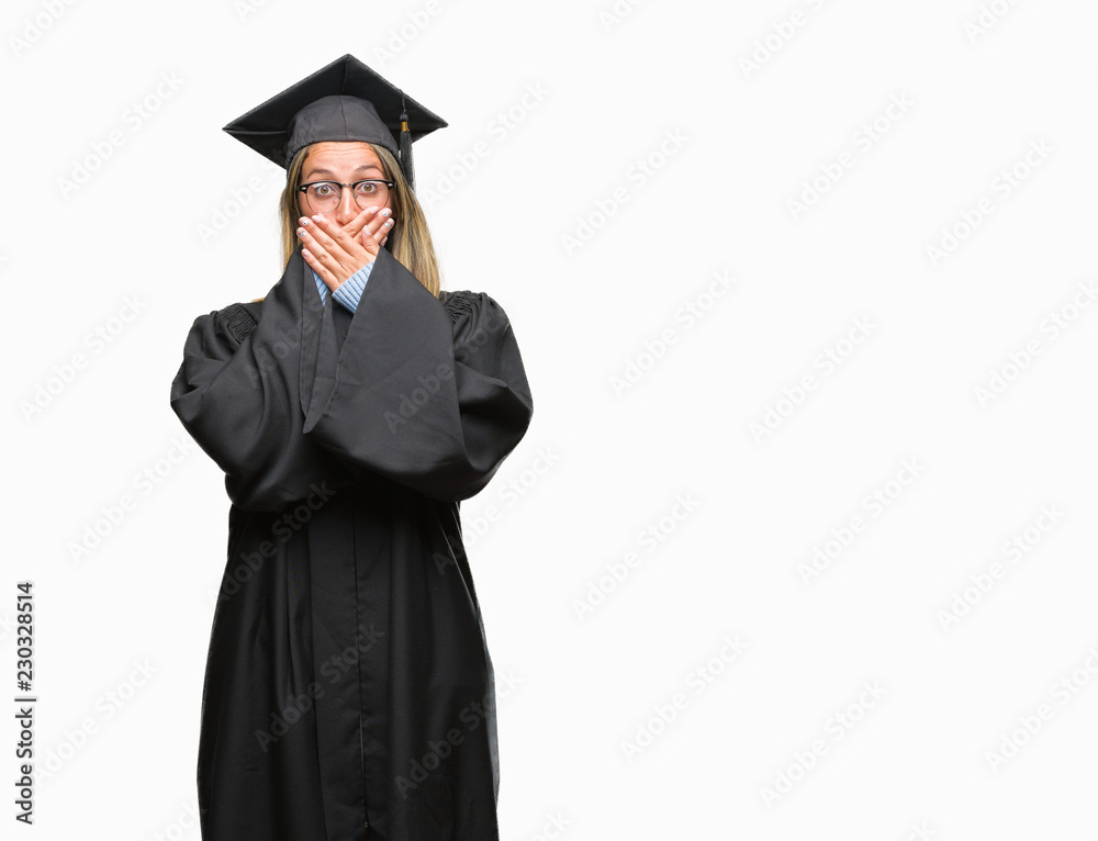 Young beautiful woman wearing graduated uniform over isolated background shocked covering mouth with hands for mistake. Secret concept. Young beautiful woman wearing graduated uniform over isolated background shocked covering mouth with hands for mistake. Secret concept.