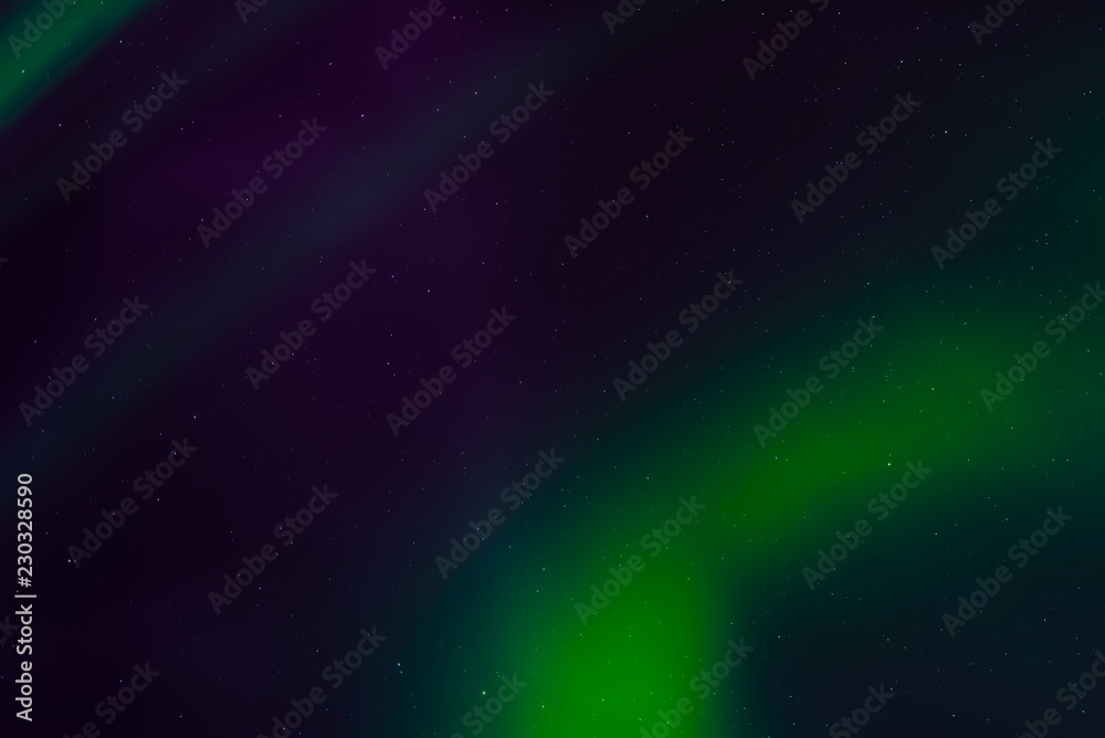 Aurora borealis, northern lights in the night sky with stars