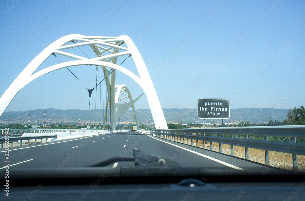 Obraz premium Driving by Ibn Abbas Firnas Bridge close to Cordoba City. View from the inside of the car