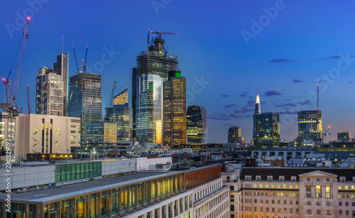  Aerial view of skyscrapers of the world famous bank district of central London after dusk