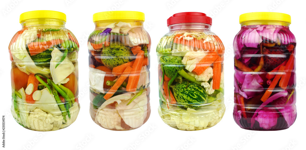 Pickled vegetables in jars isolated on white background. Pickled vegetables in jars isolated on white background.