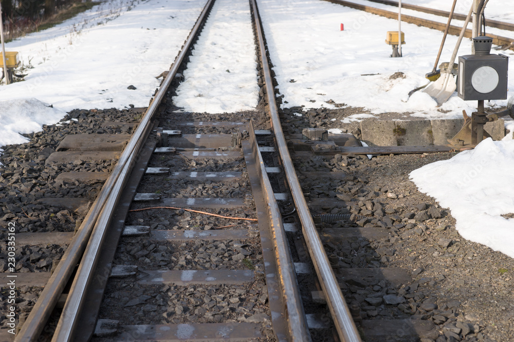 Railway tracks and switch in winter with snow Railway tracks and switch in winter with snow