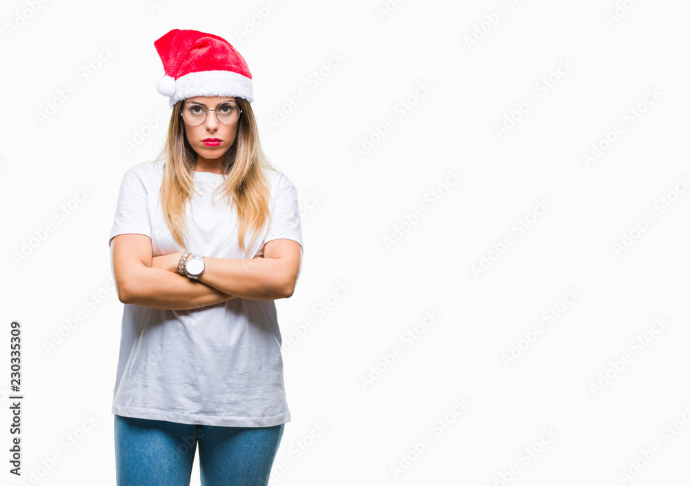 Young beautiful woman wearing christmas hat over isolated background skeptic and nervous, disapproving expression on face with crossed arms. Negative person. Young beautiful woman wearing christmas hat over isolated background skeptic and nervous, disapproving expression on face with crossed arms. Negative person.