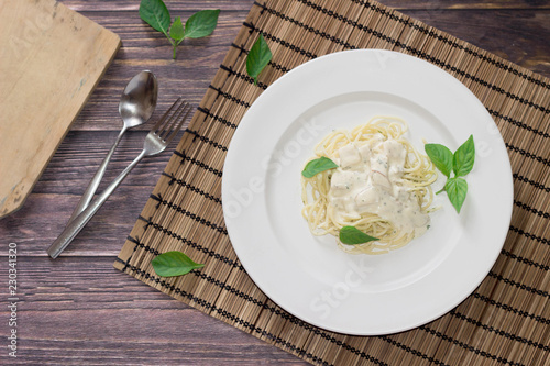 White Sauce Spaghetti a white dish on a wooden table