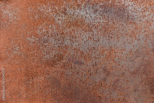 Rusty textured metal background. Rusted on surface of the old iron. © banphote