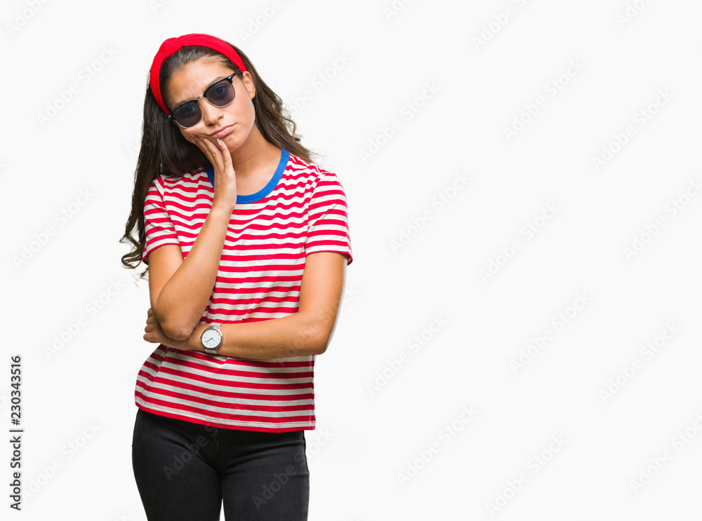 Young beautiful arab woman wearing sunglasses over isolated background thinking looking tired and bored with depression problems with crossed arms. Young beautiful arab woman wearing sunglasses over isolated background thinking looking tired and bored with depression problems with crossed arms.