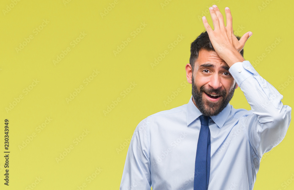 Adult hispanic business man over isolated background surprised with hand on head for mistake, remember error. Forgot, bad memory concept. - obrazy, fototapety, plakaty 