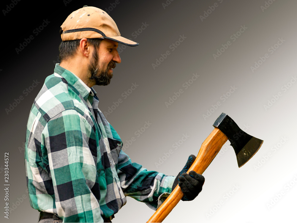 bearded man in plaid shirt with axe bearded man in plaid shirt with axe