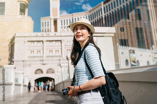Photography tourist going to join the guide tour in museum