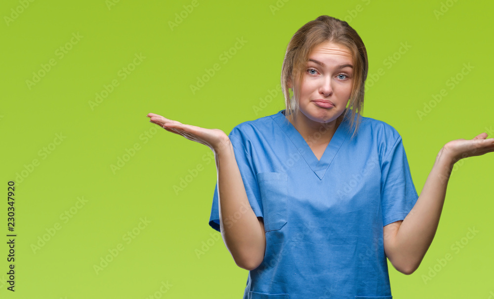 Young caucasian doctor woman wearing surgeon uniform over isolated background success sign doing positive gesture with hand, thumbs up smiling and happy. Looking at the camera with cheerful expression Young caucasian doctor woman wearing surgeon uniform over isolated background success sign doing positive gesture with hand, thumbs up smiling and happy. Looking at the camera with cheerful expression