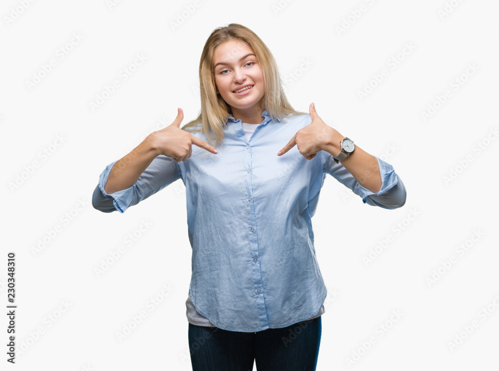 Obraz premium Young caucasian business woman over isolated background looking confident with smile on face, pointing oneself with fingers proud and happy.