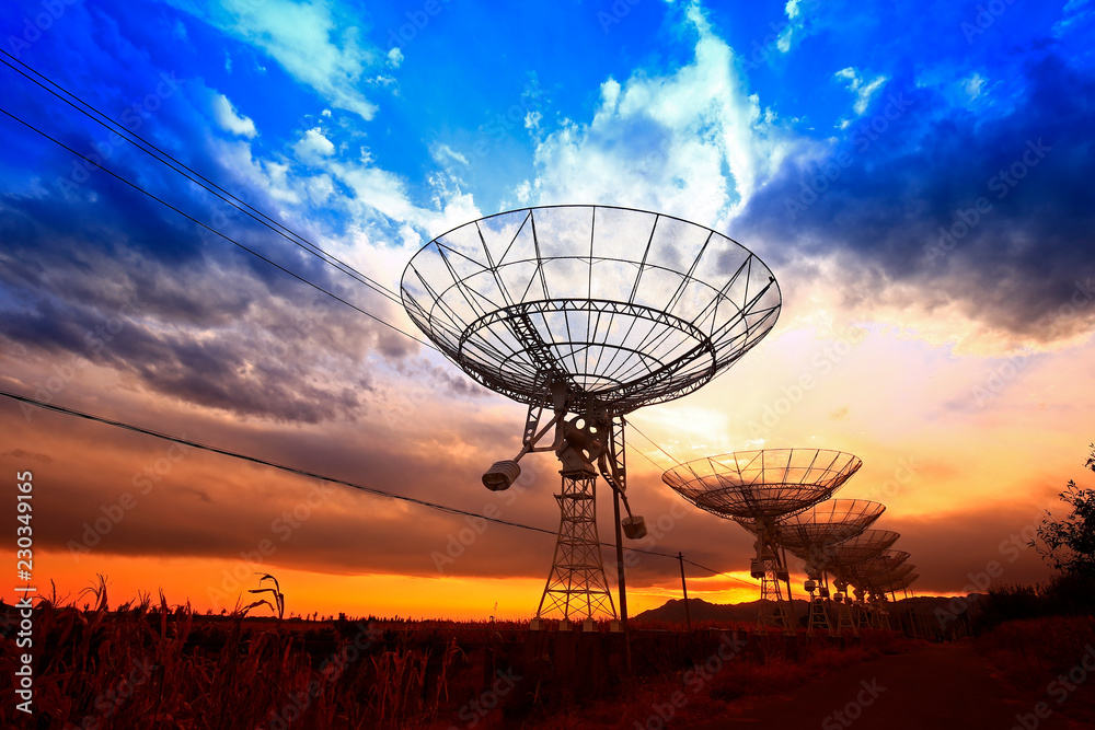 The silhouette of a radio telescope observatory The silhouette of a radio telescope observatory