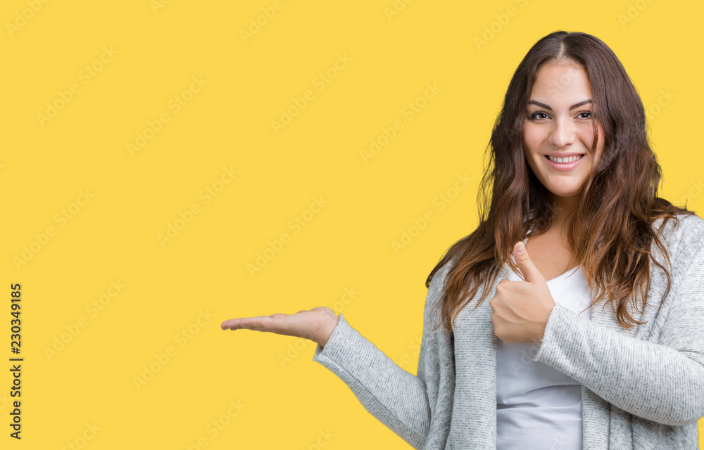 Beautiful plus size young woman wearing winter jacket over isolated background Showing palm hand and doing ok gesture with thumbs up, smiling happy and cheerful Beautiful plus size young woman wearing winter jacket over isolated background Showing palm hand and doing ok gesture with thumbs up, smiling happy and cheerful