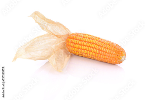 Corncob with dry leaves, isolated on white