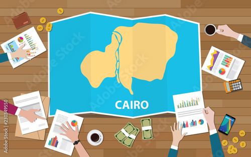 cairo egypt capital city region economy growth with team discuss on fold maps view from top