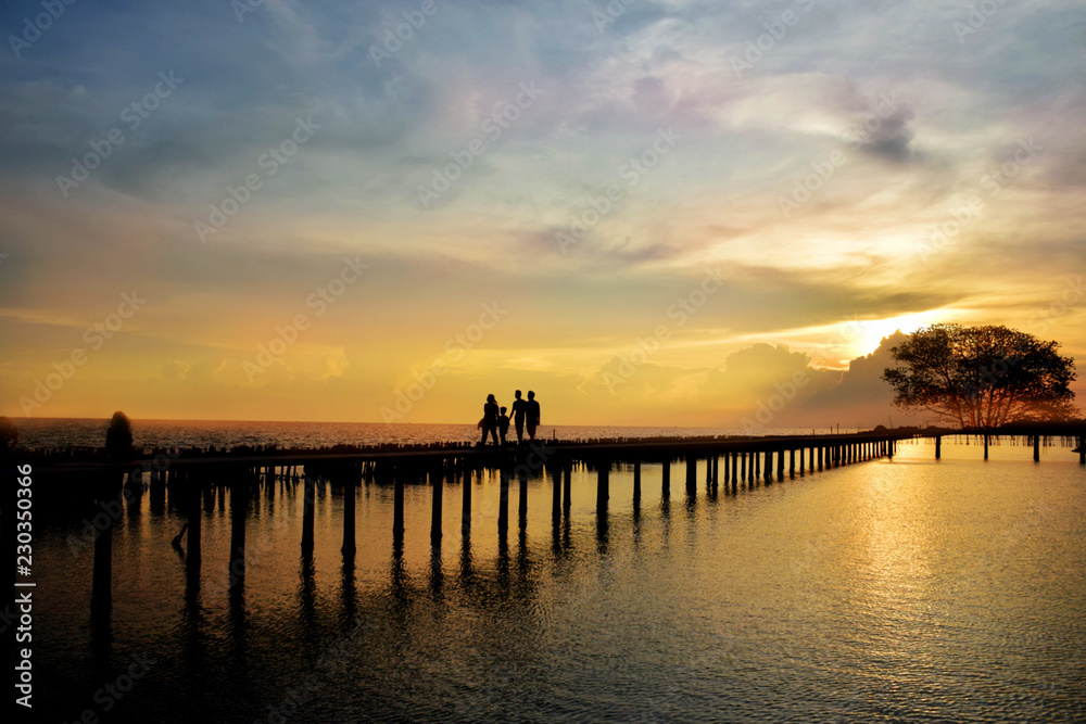 Clouse up sea sunset with long bridge