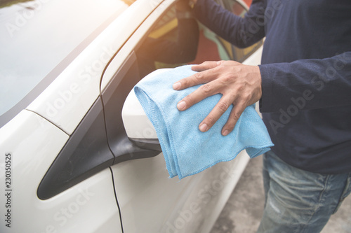 male hands cleaning car