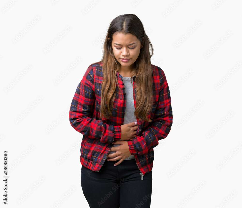 Young beautiful brunette woman wearing a jacket over isolated background with hand on stomach because indigestion, painful illness feeling unwell. Ache concept.