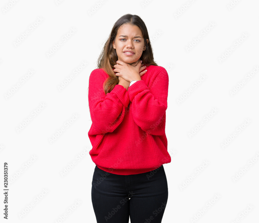 Young beautiful brunette woman wearing red winter sweater over isolated background shouting and suffocate because painful strangle. Health problem. Asphyxiate and suicide concept. Young beautiful brunette woman wearing red winter sweater over isolated background shouting and suffocate because painful strangle. Health problem. Asphyxiate and suicide concept.