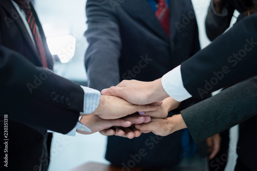 business people put their hands together.businesspeople celebrating in office success deal business, business concept, business success concept
