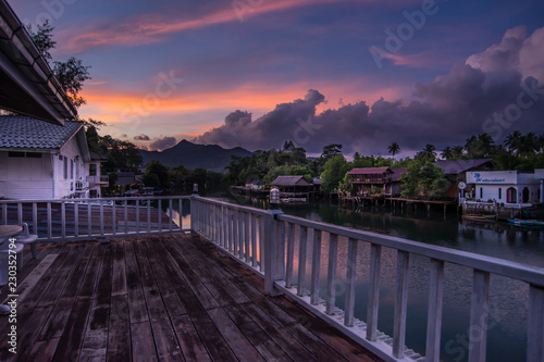 Sunrise stilts reflect in the river at klong prao district on koh chang, © somchaip
