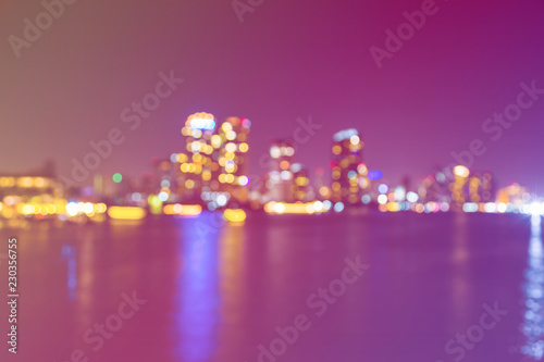 light bokeh of city on the river at night © pandaclub23