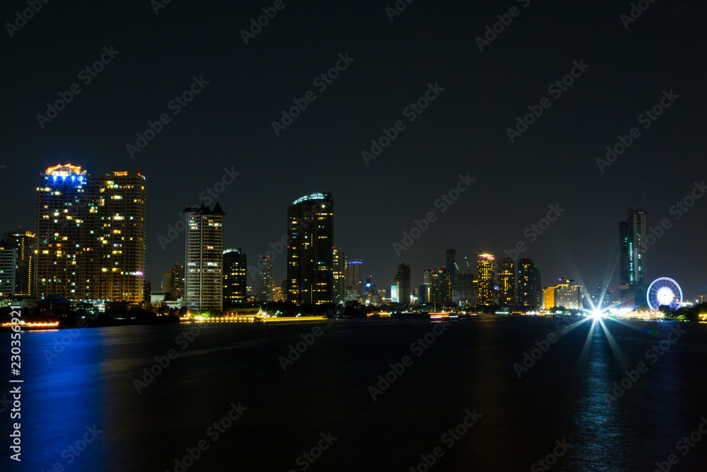 Fototapeta premium light of city on the river at night