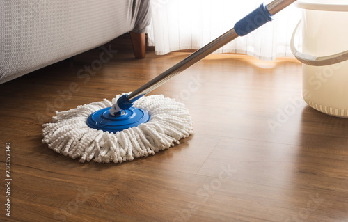 Obraz na płótnie Mop cleaning on wooden floor