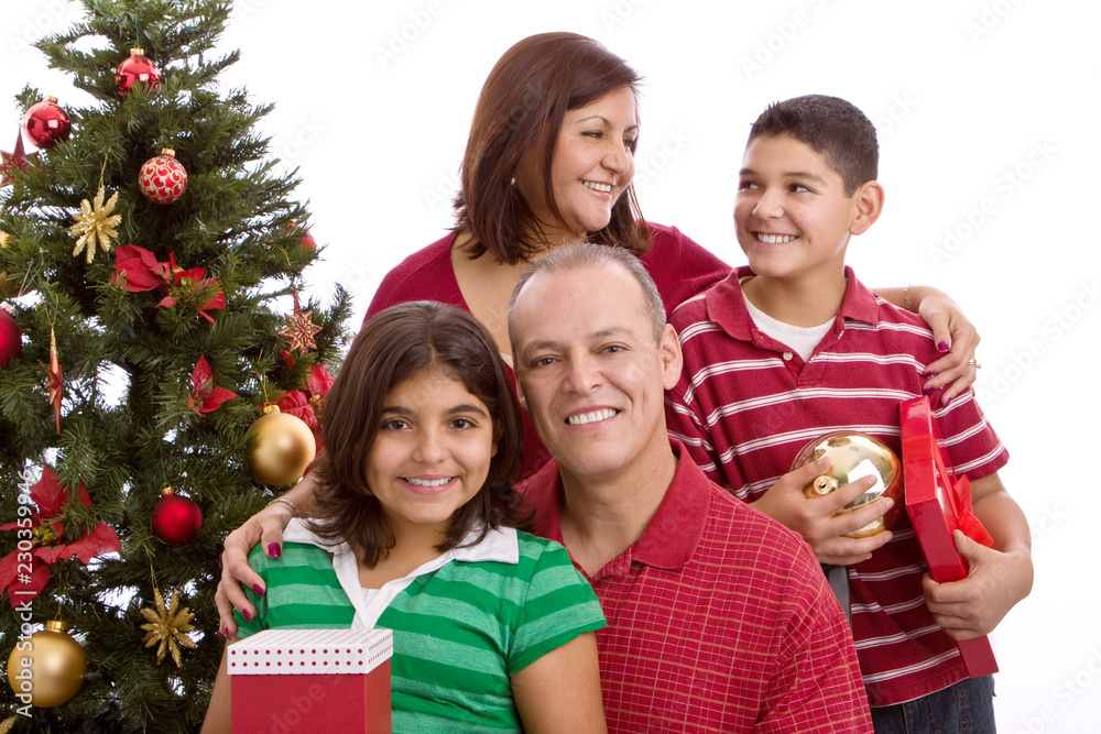 Happy Hispanic family at Christmas exchanging gifts. Happy Hispanic family at Christmas exchanging gifts.