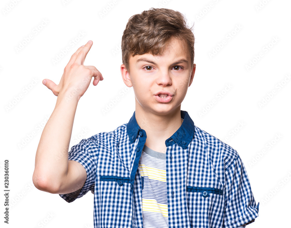 Teen boy making an imaginary gun shoot. Emotional portrait of bored teenager committing suicide with finger gun gesture. Child shooting hisself making finger pistol sign, isolated on white background Teen boy making an imaginary gun shoot. Emotional portrait of bored teenager committing suicide with finger gun gesture. Child shooting hisself making finger pistol sign, isolated on white background