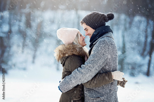 Two young people enjoying in the snow