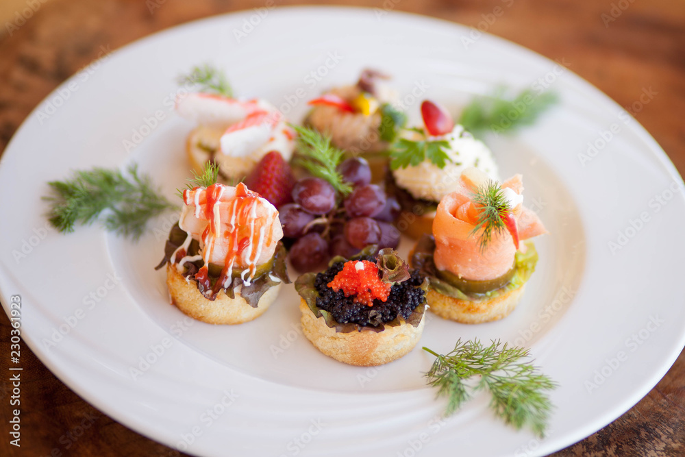 Seafood Tartlets on White Plate Seafood Tartlets on White Plate