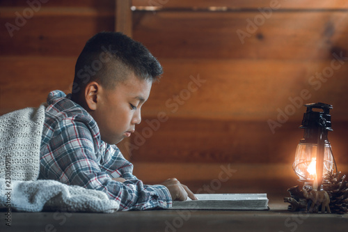 Bild auf Leinwand Boy reading the holy bible