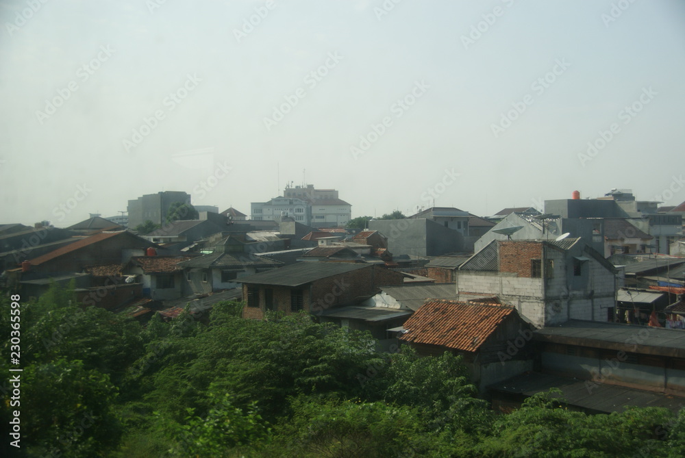 Jakarta slums area seen from a moving train