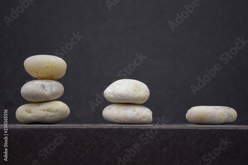 Canvas Print Gradient stones on table with free space and blur background