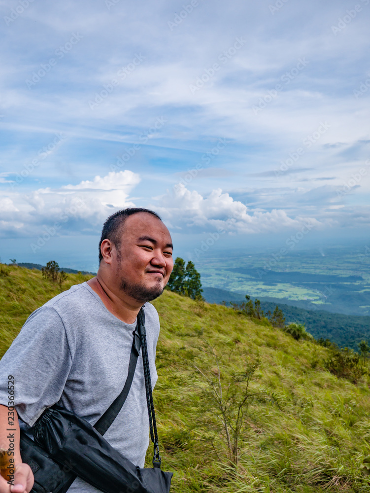 Asian Fat traveler trekking on Khao Luang mountain in Ramkhamhaeng National Park,Sukhothai province Thailand Asian Fat traveler trekking on Khao Luang mountain in Ramkhamhaeng National Park,Sukhothai province Thailand