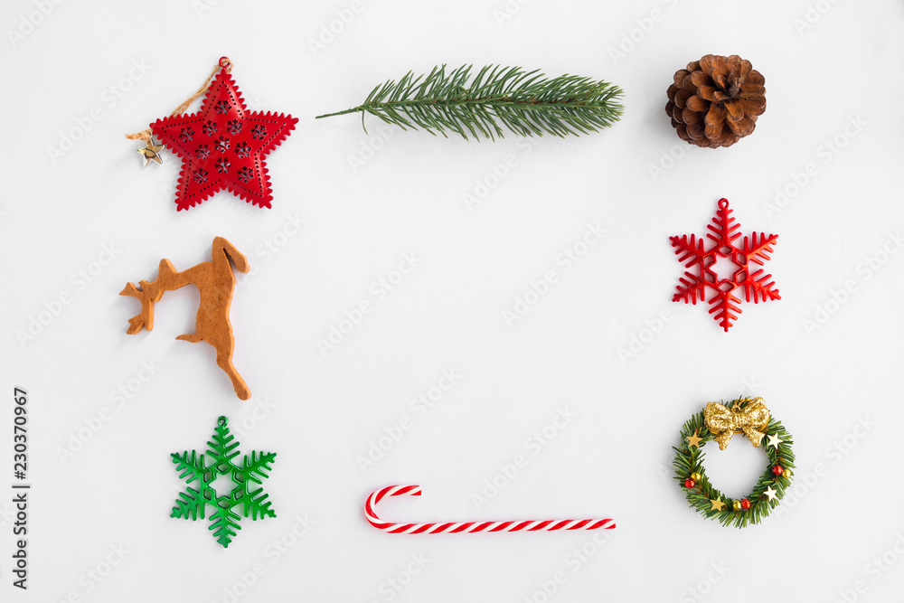 Christmas Background with decorations on white paper. Creative flat lay, top view design