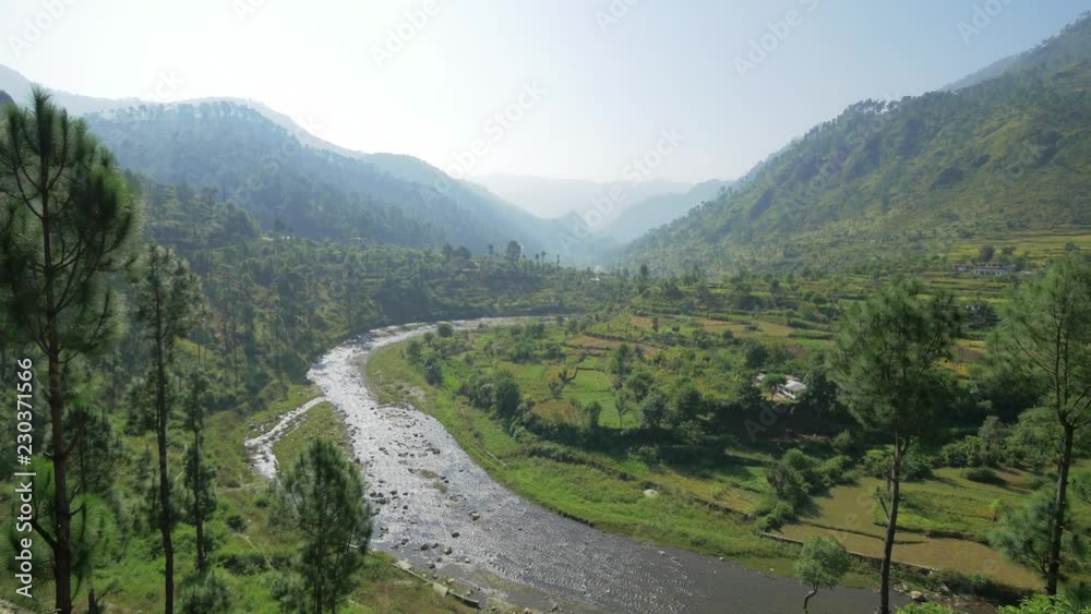 Panoramic view of mountain valley with river and rice fields. Himalayas, India Panoramic view of mountain valley with river and rice fields. Himalayas, India