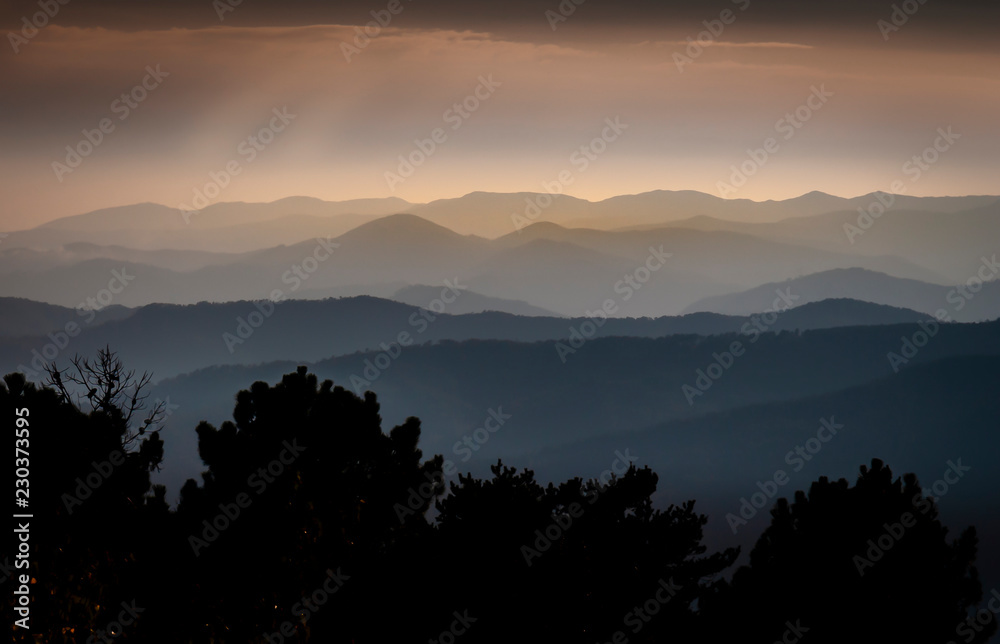 Dark mountains horizon during afternoon haze