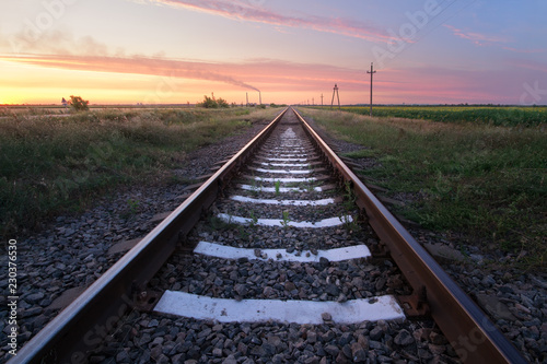 Railway in the steppe / photo right after sunset road leading to the distance