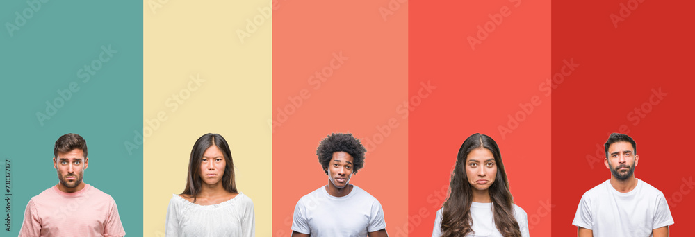 Fototapeta premium Collage of different ethnics young people over colorful stripes isolated background depressed and worry for distress, crying angry and afraid. Sad expression.