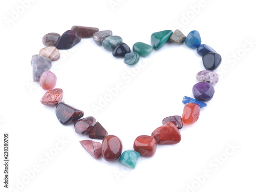 heart of colored stones on a white background