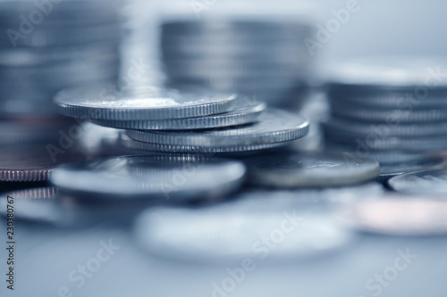 Row of coins on wood background for finance and Saving concept,Investment, Economy, Soft focus and dark style.