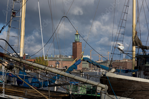 Water view over Stockholm an late autumn day, snowy, sun and clear sky over boats and landmarks © Hans Baath