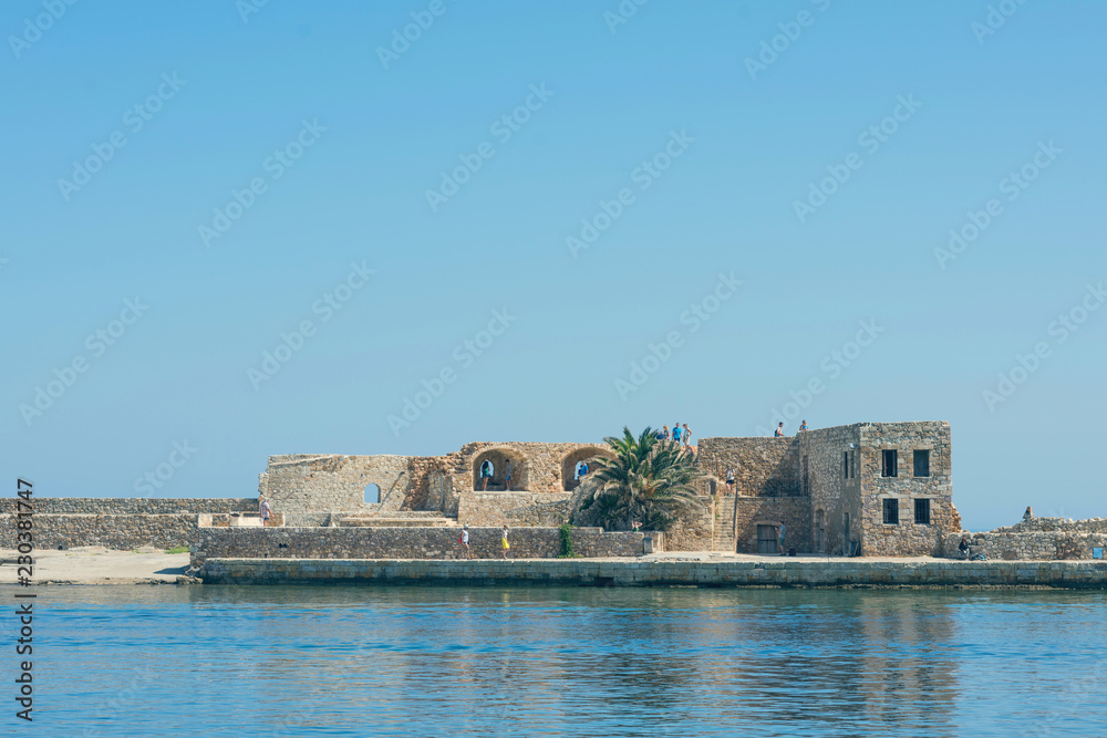 Panoramic view of the antiquity lighthouse in the old Venetian harbor Of Chania. Island of Crete. Greece