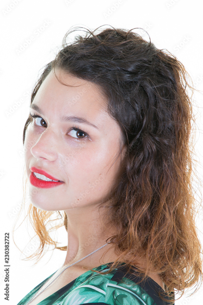 Young pretty woman with curly hairstyle smiling Girl wearing black green dress in white Studio shot Young pretty woman with curly hairstyle smiling Girl wearing black green dress in white Studio shot
